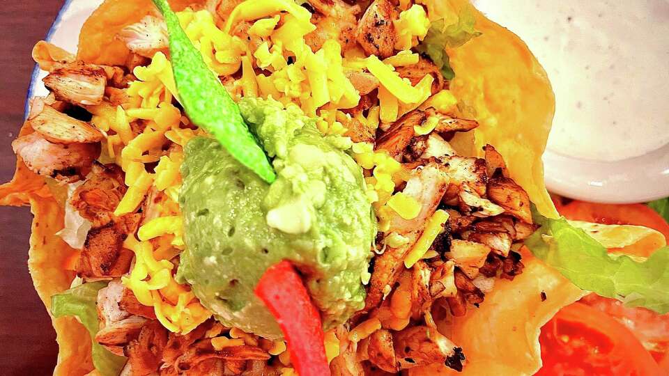 The taco salad at Tony's Mexican Restaurant is garnished with a scoop of creamy guacamole.