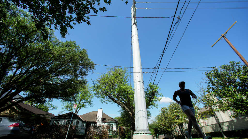 A large utility pole, installed at the corner of Fairview and Park in Montrose, is shown on Tuesday, April 11, 2023 in Houston. CenterPoint is the transmission and distribution company that delivers electricity to the area.