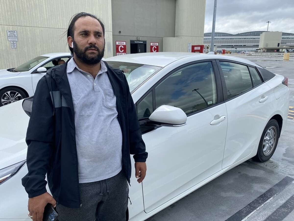 Rashad Bifawi, a Lyft driver of eight years, waits to pick up passengers at SFO Airport on August 21.