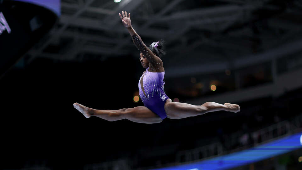 Simone Biles competes on the balance beam at the U.S. Gymnastics Championships, Friday, Aug. 25, 2023, in San Jose, Calif. (AP Photo/Jed Jacobsohn)