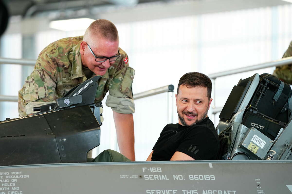 Ukrainian President Volodymyr Zelenskyy sits in an F-16 fighter jet. The U.S. and its allies are providing the advanced aircraft to Ukraine to bolster its fight against Russia. Ukrainian flight crews will receive English language instruction at Lackland Air Force Base in San Antonio.