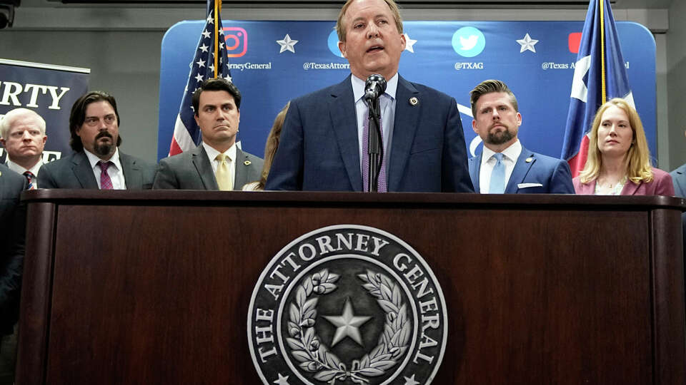 Texas Attorney General Ken Paxton, center, addresses the impeachment allegations against him at his office in Austin, Texas, Friday, May 26, 2023. He was impeached and suspended from office by the Texas House the next day.