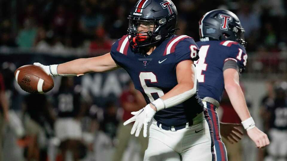 Katy Tompkins running back Dylan Rodriguez (6) fakes a handoff during the second half of a non-district high school football game at Legacy Stadium, Saturday, Aug. 26, 2023, in Katy.