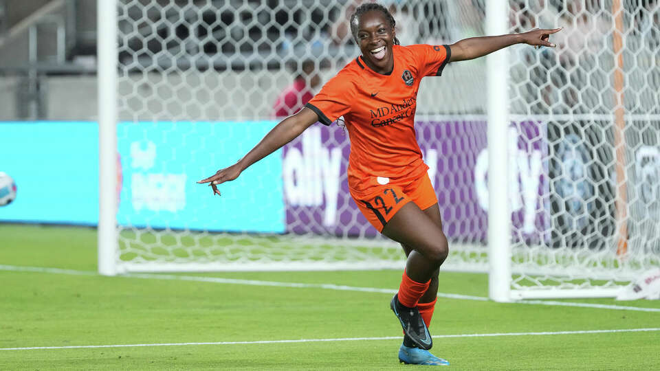 Houston Dash forward Michelle Alozie (22) celebrates after scoring against the Orlando Pride during the second half of an NWSL match at PNC Stadium on Friday, June 3, 2022, in Houston. The Dash won 5-0.