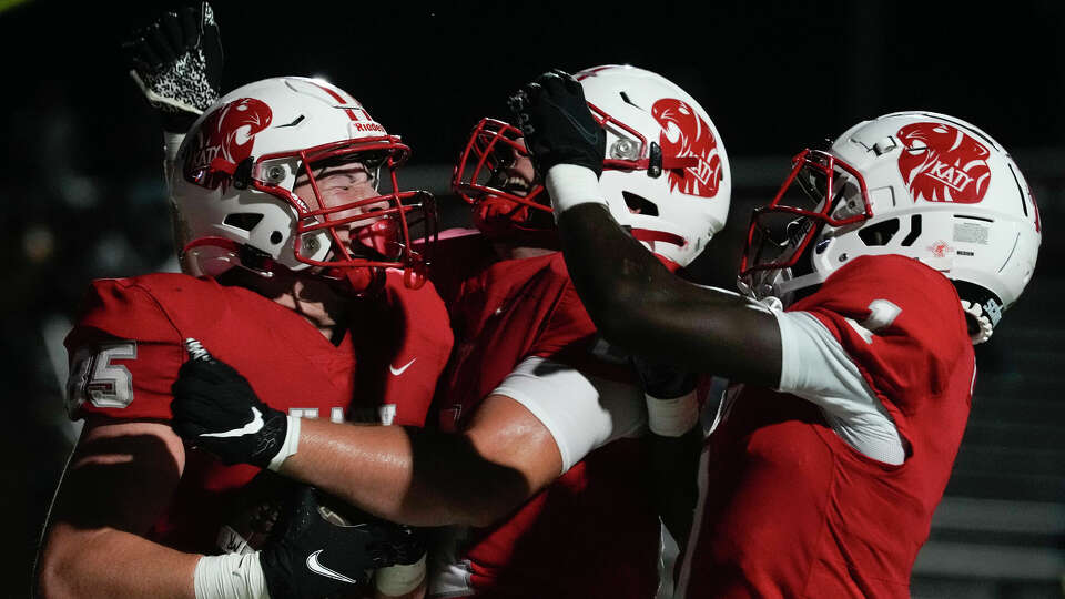 Katy tight end Colton Sanders, left, celebrates after scoring a touchdown during the third quarter of a non-district high school football game at Rhodes Stadium, Saturday, Aug. 26, 2023, in Katy.