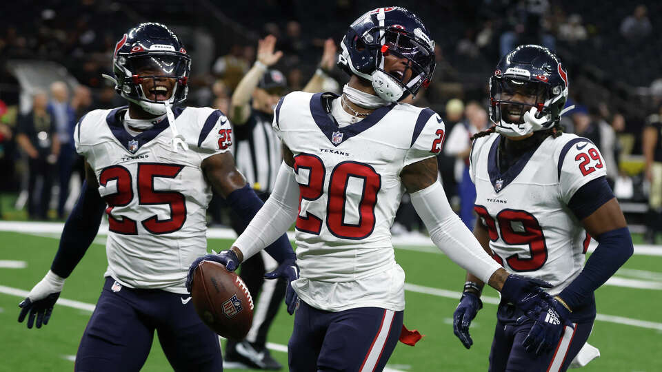 Houston Texans cornerback Cameron Dantzler (20) celebrates after intercepting a pass in the second half of a preseason NFL football game against the New Orleans Saints, Sunday, Aug. 27, 2023, in New Orleans. The Texans won 17-13. (AP Photo/Butch Dill)