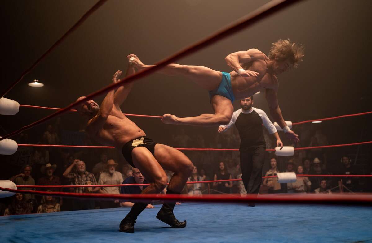 "Iron Claw" charts the rise and unimaginable fall of the storied Texas pro wrestling family the Von Erichs. Zac Efron (right) plays Kevin Von Erich, the only surviving member of that wrestling family.