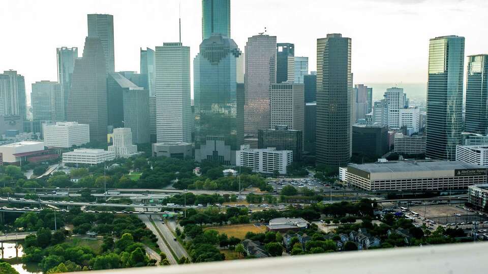 The downtown Houston skyline is visible from the helipad on the roof of The Allen condo tower on Allen Parkway near downtown Houston Tuesday, Aug. 29, 2023.