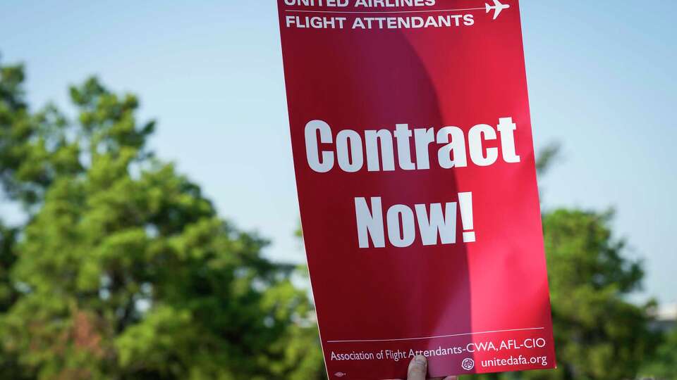 United Airlines flight attendants picket along JKF Blvd. just outside George Bush Intercontinental Airport as they seek a new contract with the airline on Thursday, Aug. 31, 2023 in Houston.