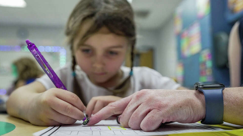 Kindergarten teacher Abby Smith in her classroom on Thursday, Aug. 31, 2023, at Cedric C. Smith Elementary School in Magnolia. After undergoing weight loss surgery November of last year due to health concerns, Abby has lost 86 pounds and says she no longer gets tired so quickly and is able to better engage with her students.