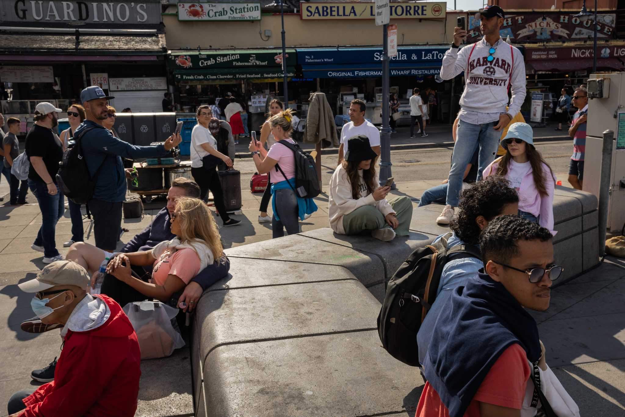 How do Fisherman's Wharf tourists and merchants feel after Pier 39