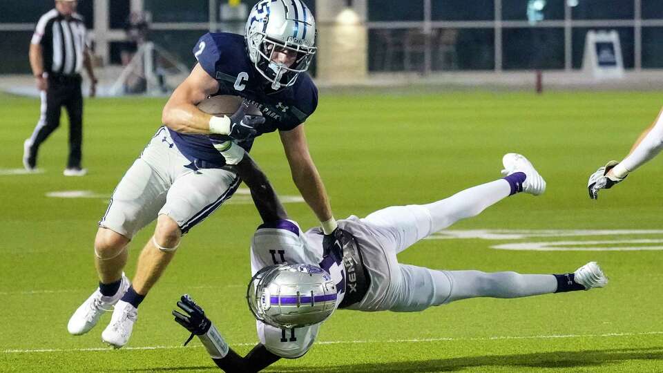 College Park's Conner Dunphy (2) runs pastKlein Cain's Marcus Coleman (11) on his way to a running touchdown during the first half of a high school football game at Woodforest Bank Stadium on Thursday, Aug. 31, 2023 in Shenandoah.