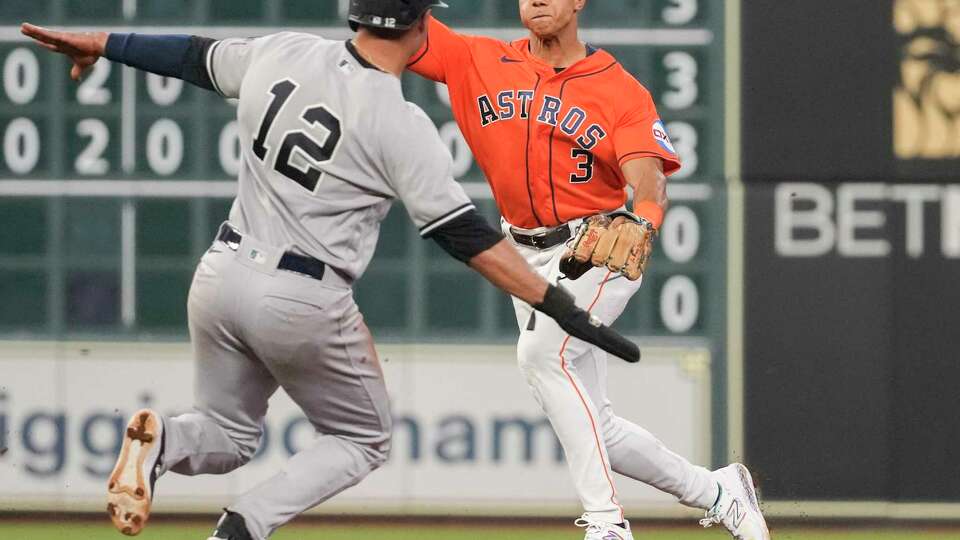 Houston Astros shortstop Jeremy Peña (3) turns New York Yankees Austin Wells's ground ball for double play in the sixth inning of a Major League Baseball game at Minute Maid Park, Friday, Sept. 1, 2023, in Houston.