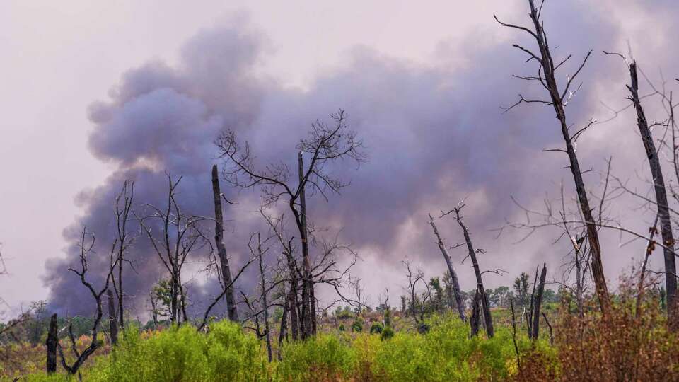 Smoke rises from a wildfire in rural Walker County, that has spread up to 3,800 acres, on Saturday, Sept. 2, 2023 north of Huntsville. The fire, that has been dubbed the Game Preserve Fire, in Walker County is 20% contained, authorities said.