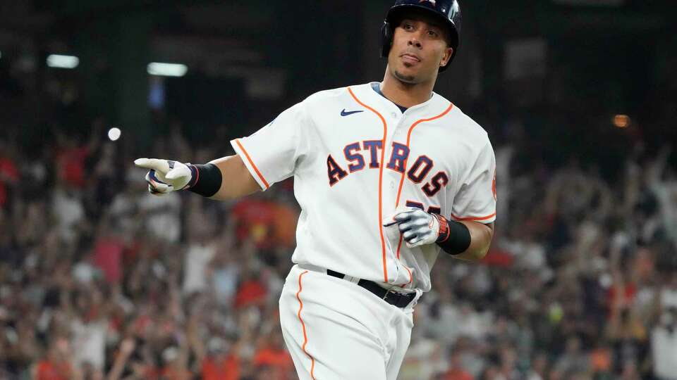 Houston Astros Michael Brantley (23) points to the dugout after hitting a home run against New York Yankees starting pitcher Luis Severino during the second inning of a MLB baseball game at Minute Maid Park on Saturday, Sept. 2, 2023 in Houston.