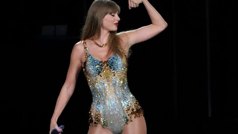 Swift is shown here flexing her strength as a concert phenomenon during The Eras Tour on Aug. 7 at SoFi Stadium in Los Angeles. The L.A. shows were filmed for the movie 