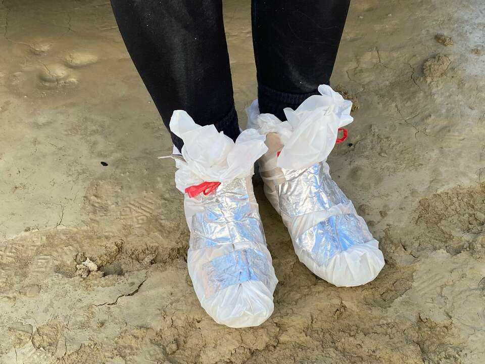 burning man rain bags for feet Burning Man's mud-defying footwear fashion show