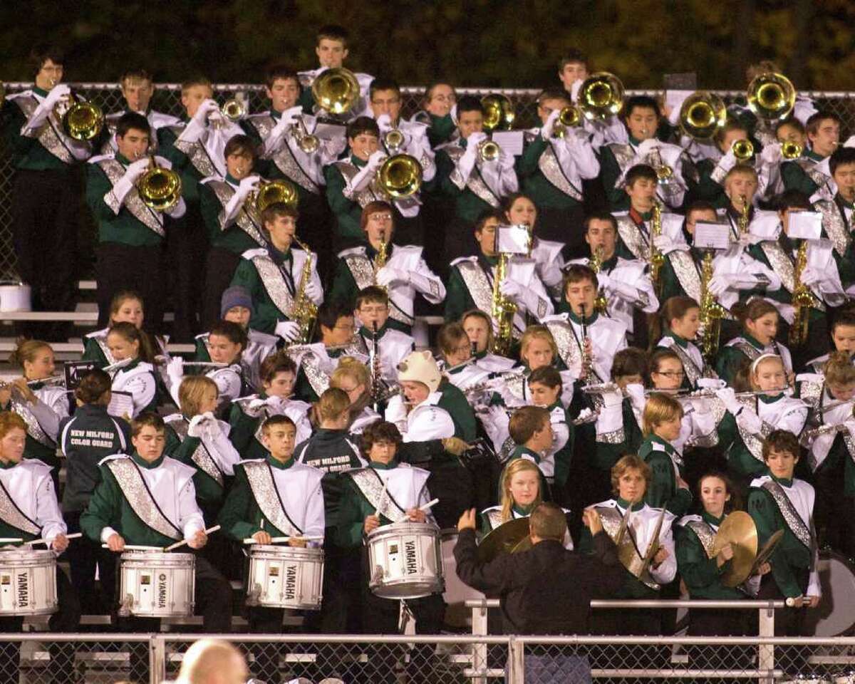 The Green Wave band plays the National Anthem prior to New Milford's football game against Brookfield Friday night, Oct. 23, 2010, at New Milford High School.