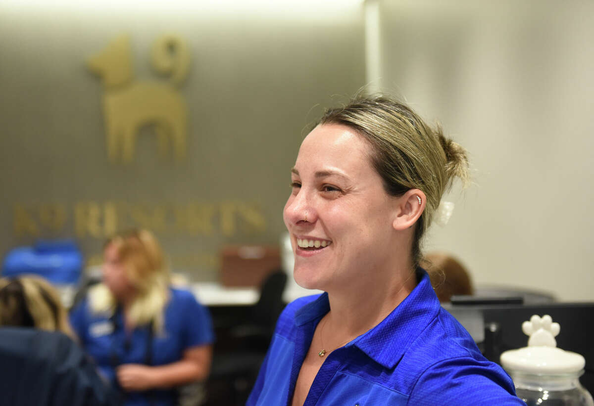 Operations manager Jessica Reitemeyer chats at K9 Resorts Luxury Pet Hotel in Stamford, Conn. Thursday, Sept. 7, 2023. The luxury dog boarding and day care facility features state-of-the-art amenities, hands-on care, and more than 2,000 square feet of outdoor space.