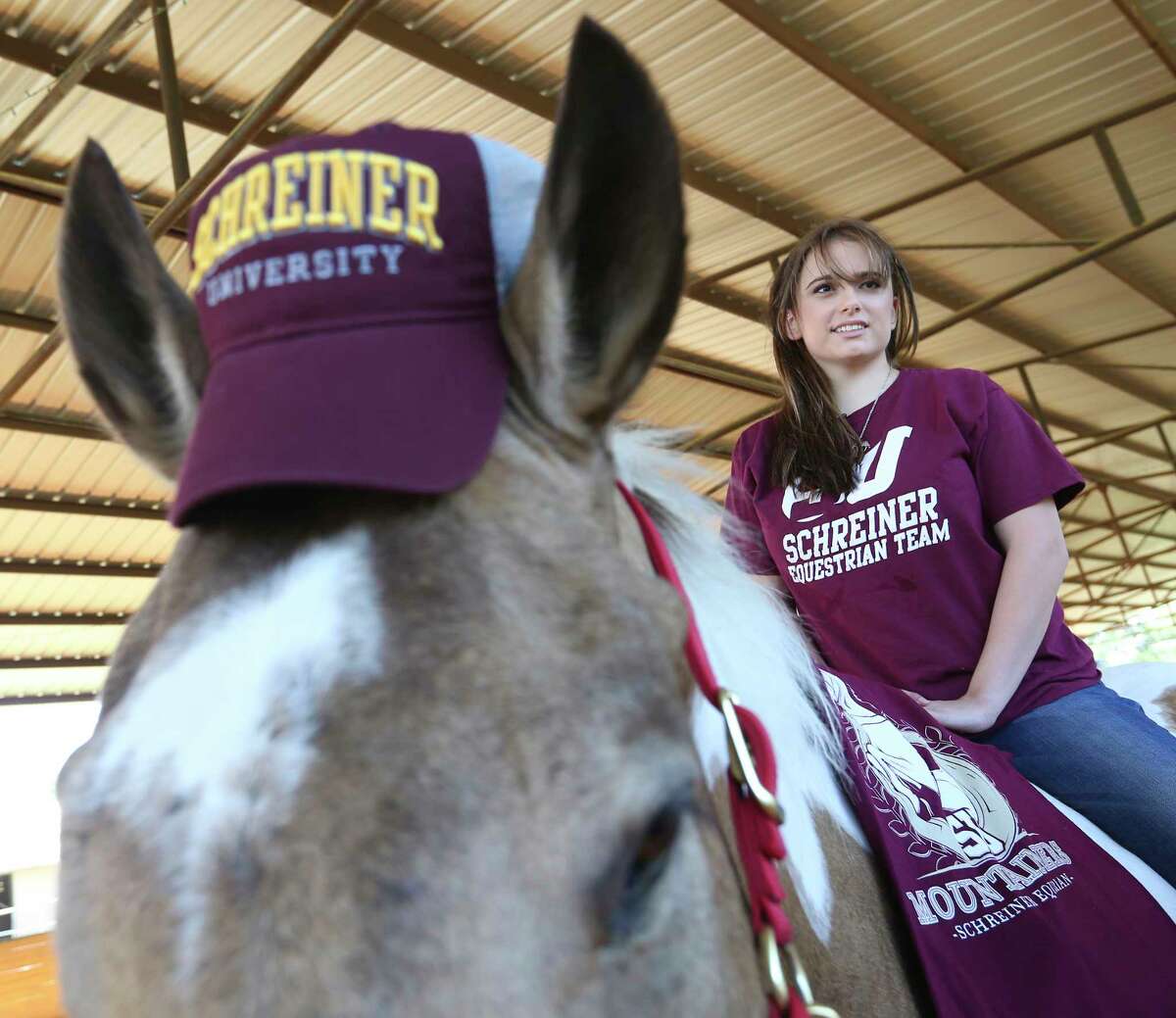 Kayla Reinagel sits on her horse, Tonka, after committing in 2018 to the Schreiner University equestrian team. 