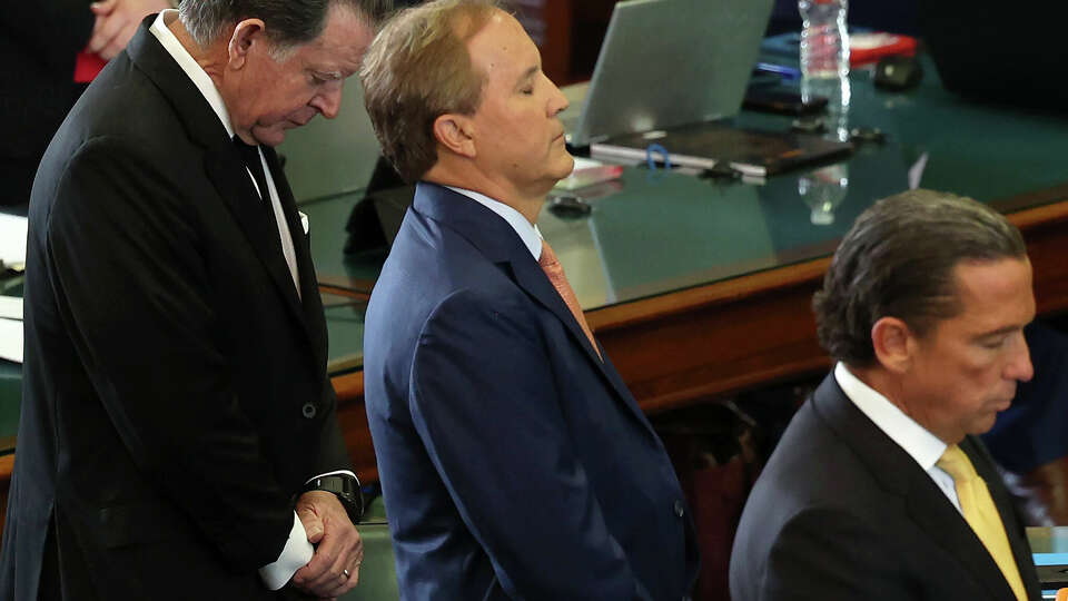 Suspended Texas Attorney General Ken Paxton with his defense at the start of his impeachment trial in the Senate Chambers at the State Capitol in Austin, Texas, Tuesday, Sep. 6, 2023