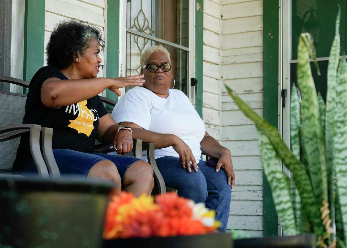 Leisa Glenn, a Fifth Ward resident whose family home is across from the former Southern Pacific rail yard site, visits with Mary Hutchins in the neighborhood, Friday, Sept. 8, 2023, in Houston. The site used creosote, a wood preservative the Center for Disease Control and Prevention says has been been shown to increase cancer, for decades prior to Souther Pacific’s takeover of the site in 1997, but a toxic plume of contamination remains underground. Glenn still maintains her family’s home on Lavender Street, but hasn’t lived in the family’s home full-time since 2005. “I stopped living there full time because I just don’t want to die of cancer like so many others,” she said.
