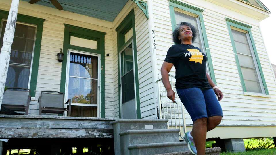 Leisa Glenn, a Fifth Ward resident whose family home is across from the former Southern Pacific rail yard, leaves the home of Mary Hutchins, a neighbor on the street, after a visit, Friday, Sept. 8, 2023, in Houston. The railroad burned creosote, a wood preservative the Center for Disease Control and Prevention says has been been shown to increase cancer, for decades prior to Souther Pacific's takeover of the site in 1997, but a toxic plume of contamination remains underground. Glenn still maintains her family's home on Lavender Street, but hasn't lived in the family's home full-time since 2005. 