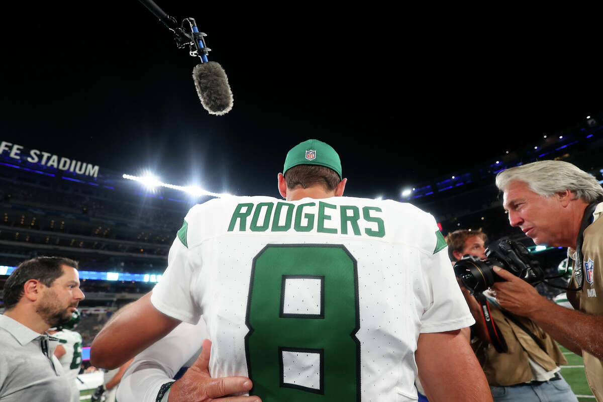 New York Jets quarterback Aaron Rodgers (8) calls out a play to his  teammates during the first half of an NFL preseason football game against  the New York Giants, Saturday, Aug. 26