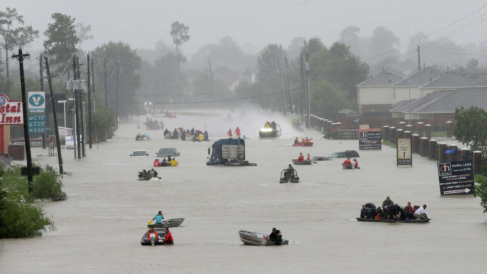 Rescue boats work along Tidwell at the east Sam Houston Tollway helping to evacuate people Monday, August 28, 2017 in Houston. Much of the area is flooded from rains after Hurricane Harvey. ( Melissa Phillip / Houston Chronicle)