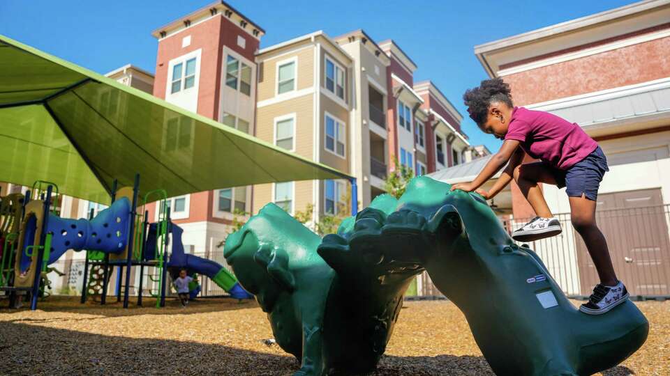 A student plays at The Regency Lofts Pre-K School, which is one of a handful of affordable housing complexes offering free early childhood education to residents on Friday, Sept. 8, 2023, in Houston.