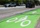 Article Image Vehicles pass by a bike lane along East 11th Street, Wednesday, Aug. 23, 2023, in Houston.
