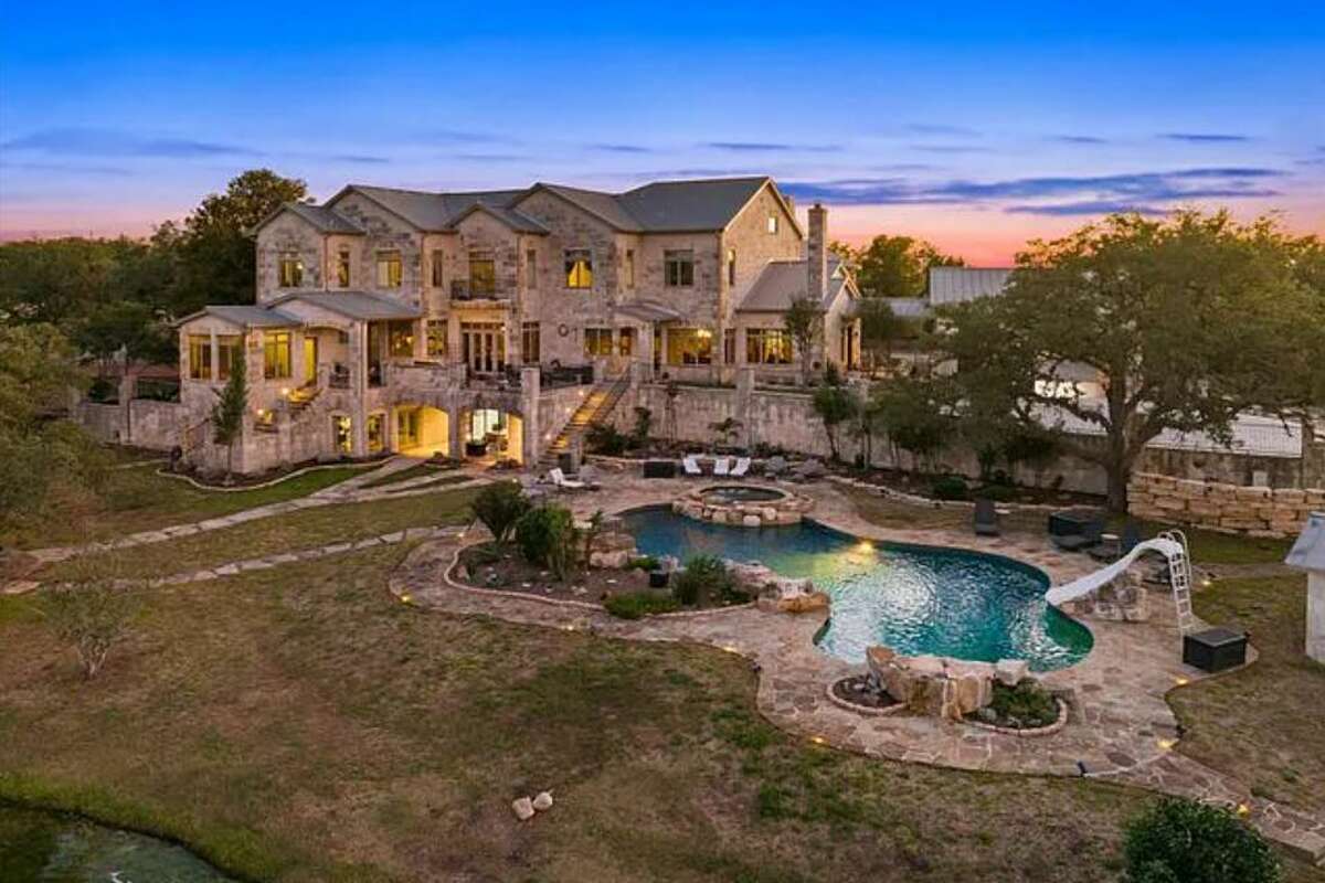 Step inside this 8M ranch neighboring a Hill Country state park