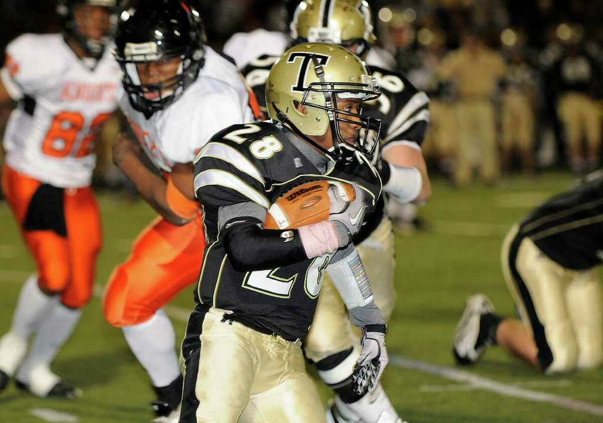 Trumbull's #28 carries as Trumbull High School hosts Stamford High School in Trumbull, CT on Friday, October 22, 2010.