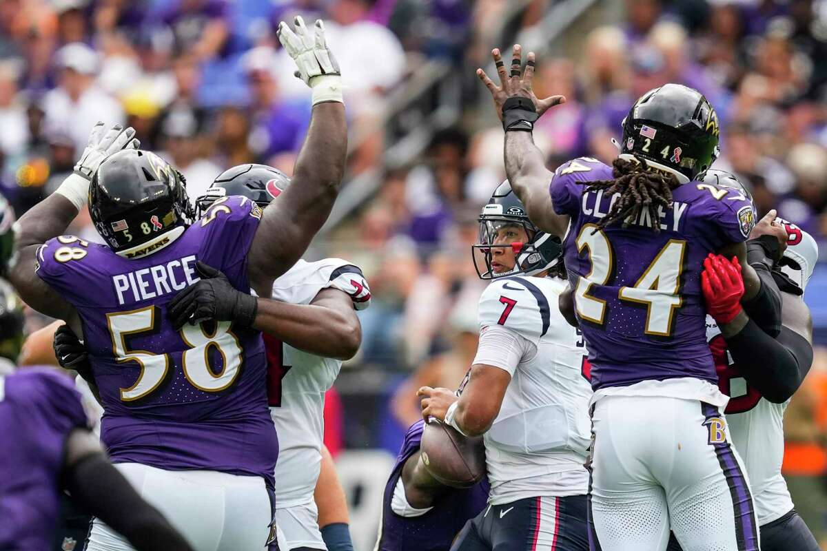 Justin Madubuike of the Baltimore Ravens reacts after a tackle