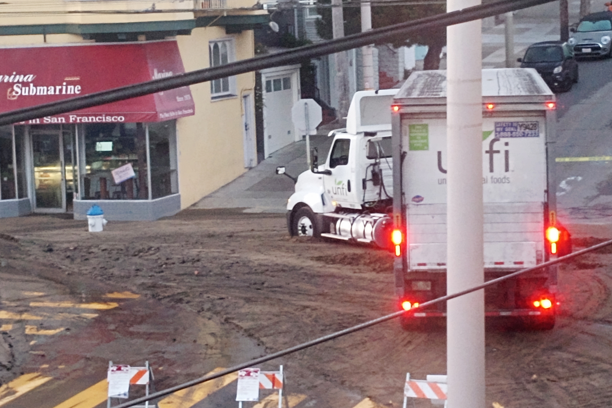 Debris floods Cow Hollow in water main break