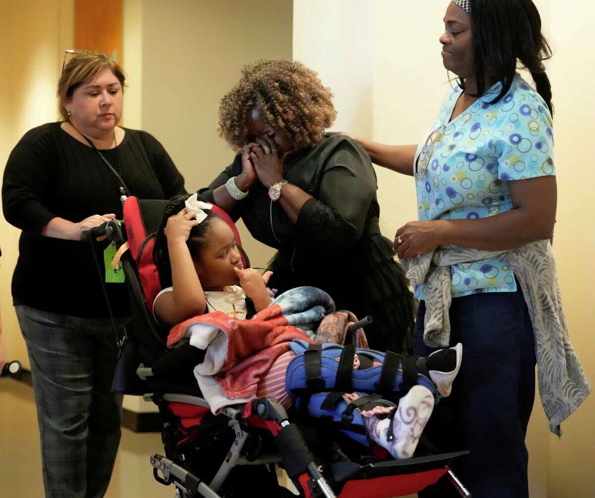Clara Clark, center, with her granddaughter, Nevaeh Hall, 11, is comforted after being told to remove the child from the courtroom during closing arguments in the trial of Bethaniel Jefferson Tuesday, Sept. 12, 2023, in Houston. Jefferson, who was a dentist lost her license after the then 4-year-old Nevaeh Hall suffered a serious brain injury during a dental procedure. Bethaniel Jefferson was charged in 2017 with injury to a child in connection with the 2016 incident.