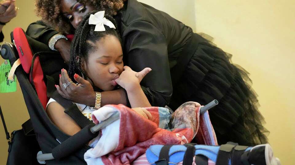 Clara Clark hugs her granddaughter, Nevaeh Hall, 11, after the child was removed from the courtroom during closing arguments in the trial of Bethaniel Jefferson Tuesday, Sept. 12, 2023, in Houston. Jefferson, who was a dentist lost her license after the then 4-year-old Nevaeh Hall suffered a serious brain injury during a dental procedure. Bethaniel Jefferson was charged in 2017 with injury to a child in connection with the 2016 incident.