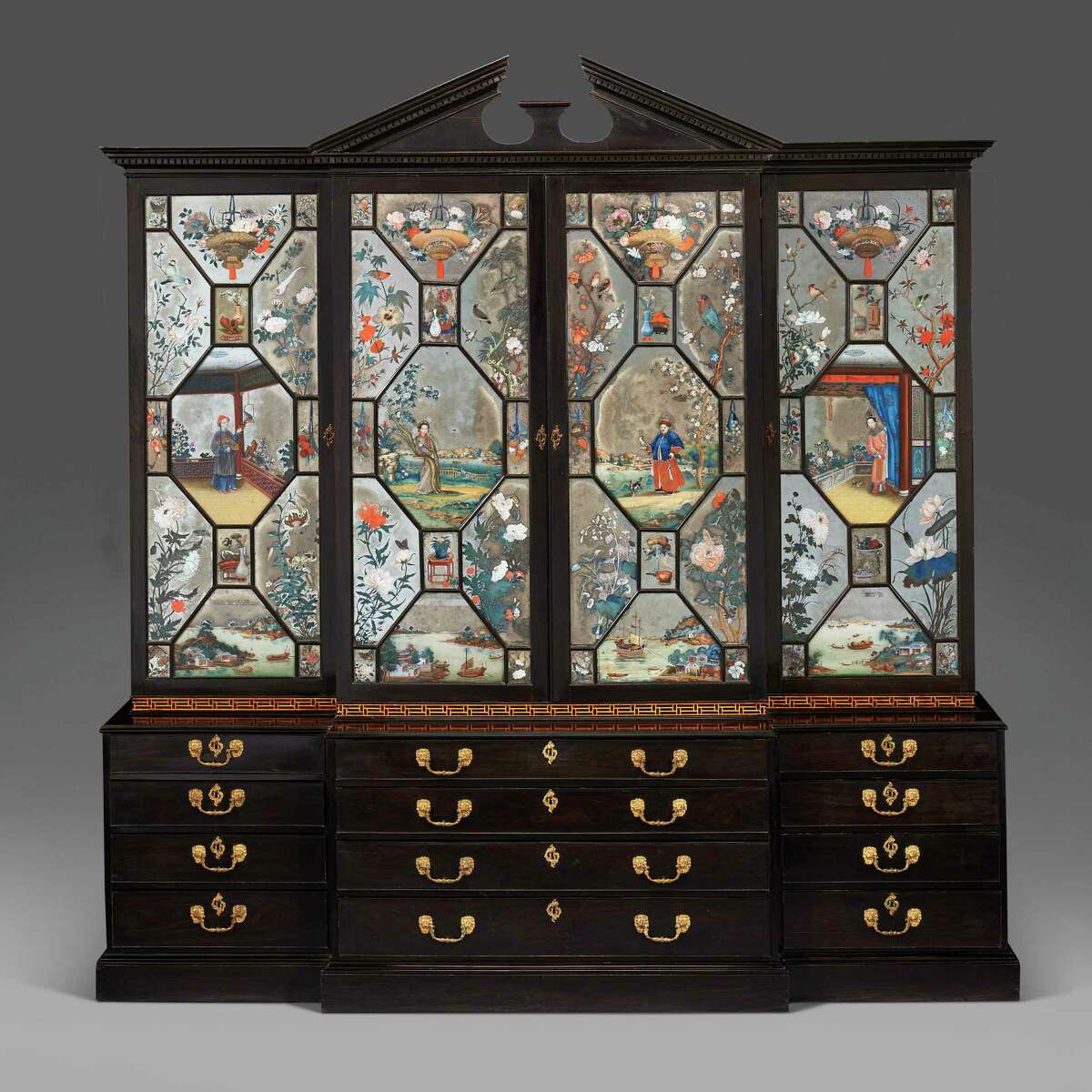 Ebony and china reverse-painted mirror bookcase from the early reign of George II, circa 1760.