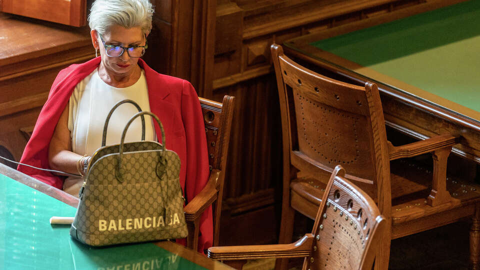 Suspended Attorney General Ken Paxton's alleged girlfriend Laura Olson waits Wednesday, Sept. 13, 2023, in the Capitol library in Austin to be called to testify in Paxton's impeachment trial.