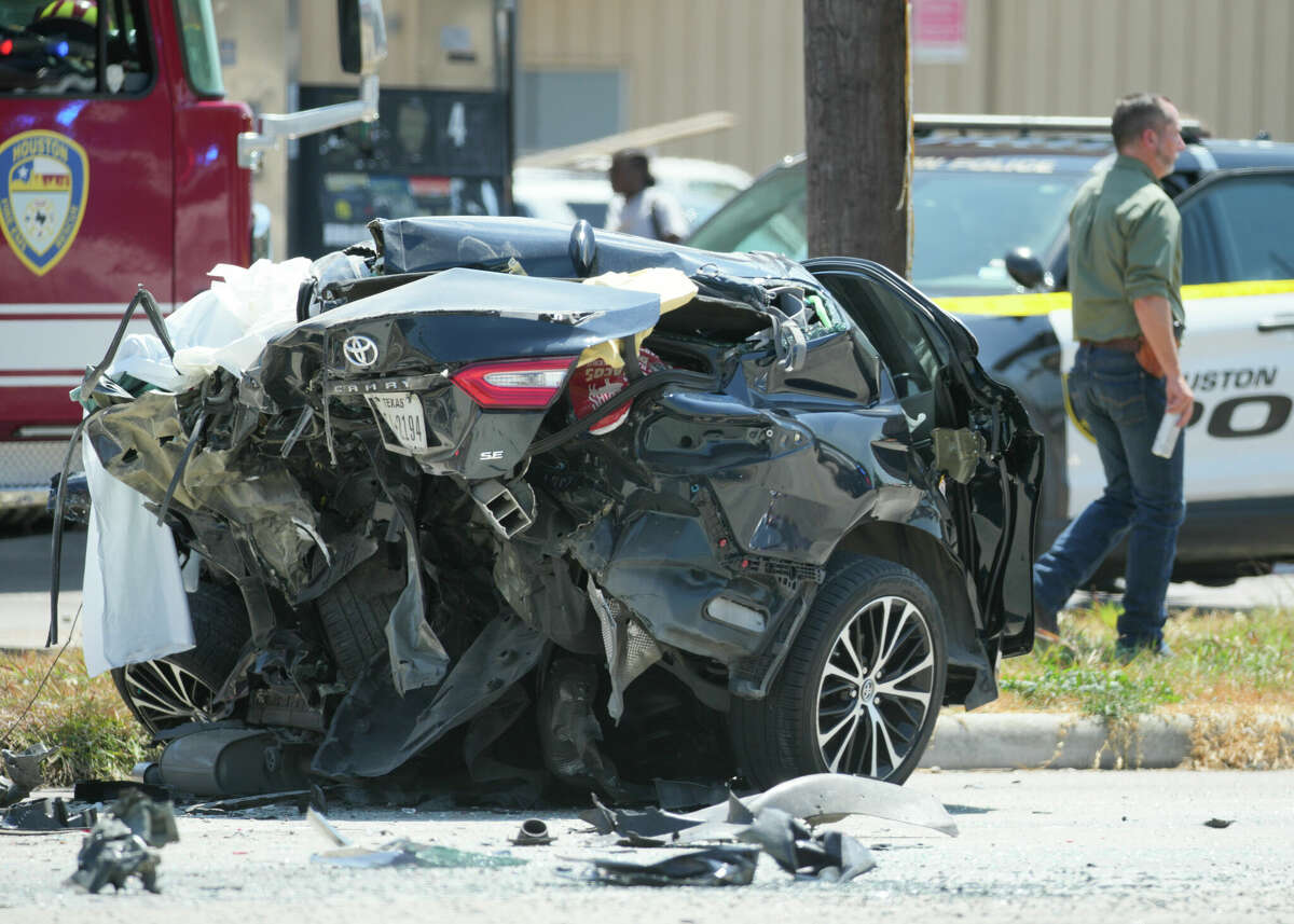 Members of the Houston Police Department and Houston Fire Departments work the scene of a fatal accident after a police chase involving two suspect in a stolen vehicle ended at Martin Luther King Boulavard and Ben Fleet Street, Thursday, Sept. 7, 2023, in Houston. Gloria Collins, the mother of an HPD sergeant, died. Two others were injured. 
