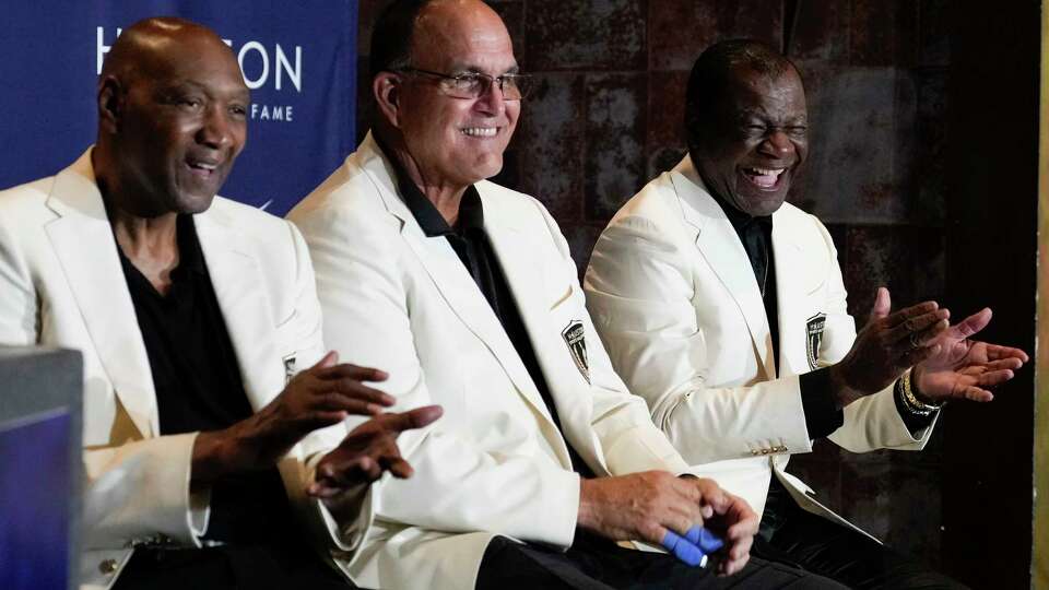 Elvin Hayes, left, Bruce Matthews and Calvin Murphy are seen during the Houston Sports Hall of Fame ring ceremony and walk of fame unveiling at House of Blues, Thursday, Sept. 14, 2023, in Houston.