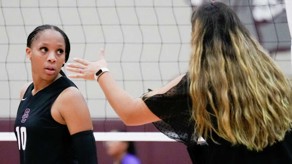 Summer Creek middle hitter Taylor Larkin (10) listens to head coach Sarah Aguilar during the second set of a District 21-6A high school volleyball match at Summer Creek High School, Tuesday, Sept. 12, 2023, in Houston.