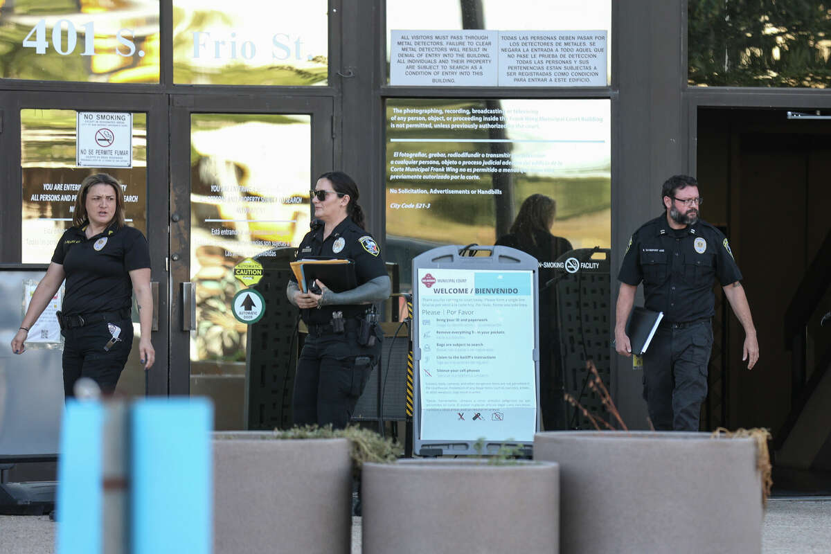 San Antonio Animal Care Services officers walk out of Municipal Court on Thursday, Sept. 14, 2023, after attending a hearing. Judge Lisa Gonzales ruled that Gregory Palmer’s dog will be euthanized by the ACS after the dog mauled Palmer’s neighbor last week causing serious injuries.