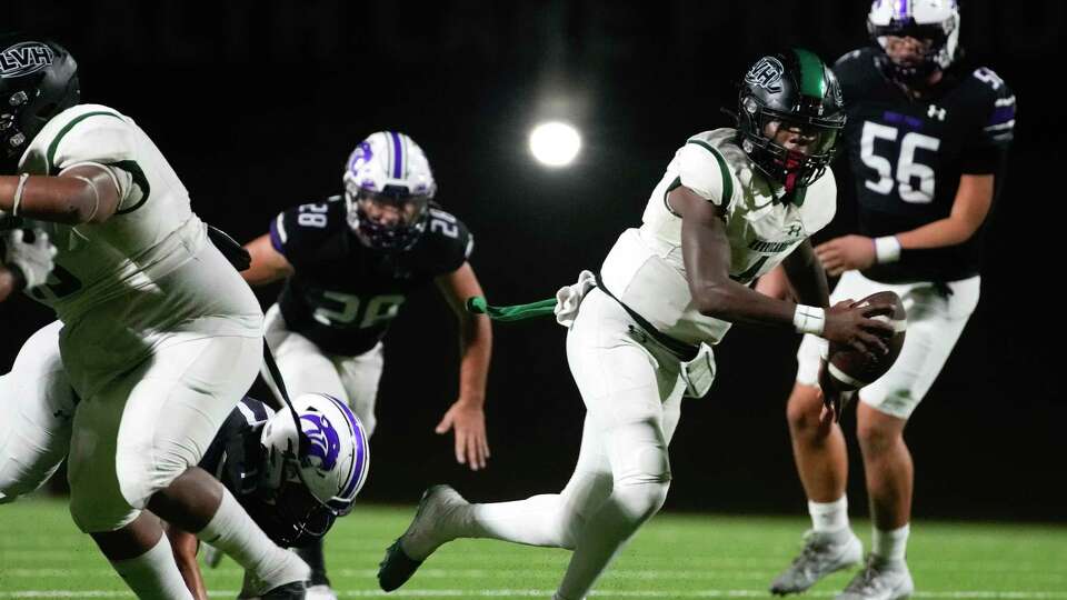 Hightower quarterback Joseph Stewart (1) escapes for a first down during the third quarter of a District 20-6A high school football game at Edward Mercer Stadium, Thursday, Sept. 14, 2023, in Sugar Land.