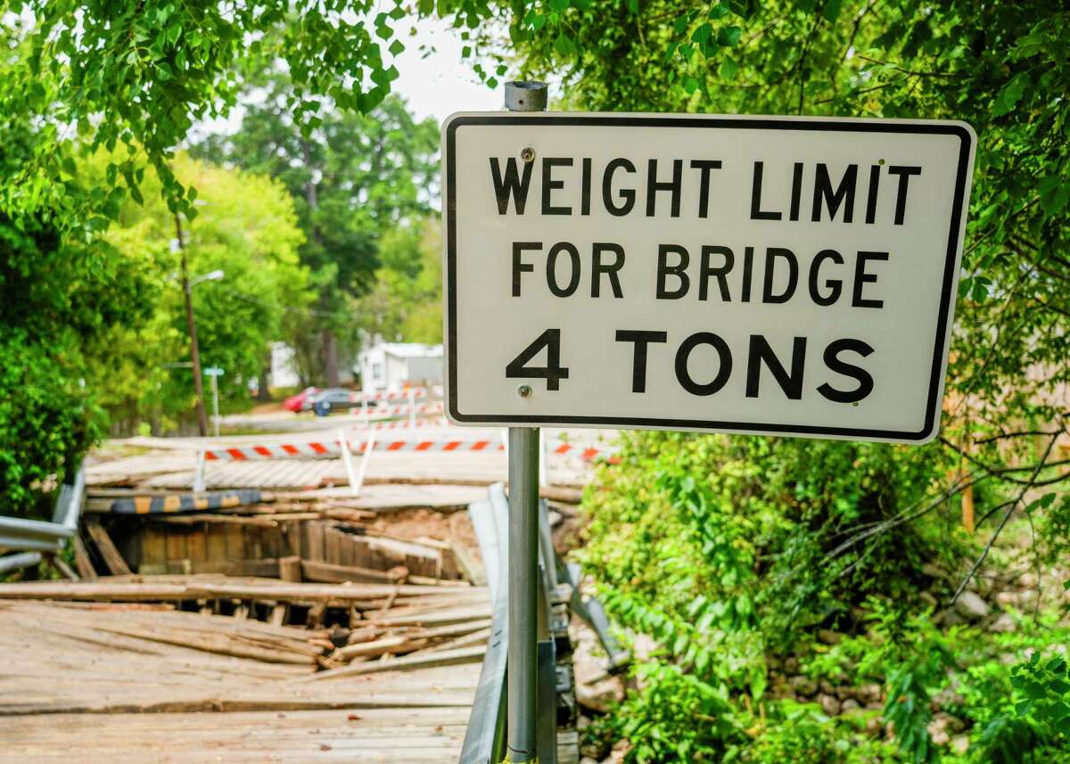A wooden bridge in the Walnut Cove neighborhood of Willis is seen after it collapsed when a 30-ton concrete truck smashed through the beams Thursday morning while crossing, Friday, Sept. 15, 2023. The driver of the truck was not injured in the accident. The wooden bridge, near the intersection of Maywood and Sassafras streets, was constructed in 1987, and has a 4-ton weight limit, according to signs posted near the bridge.