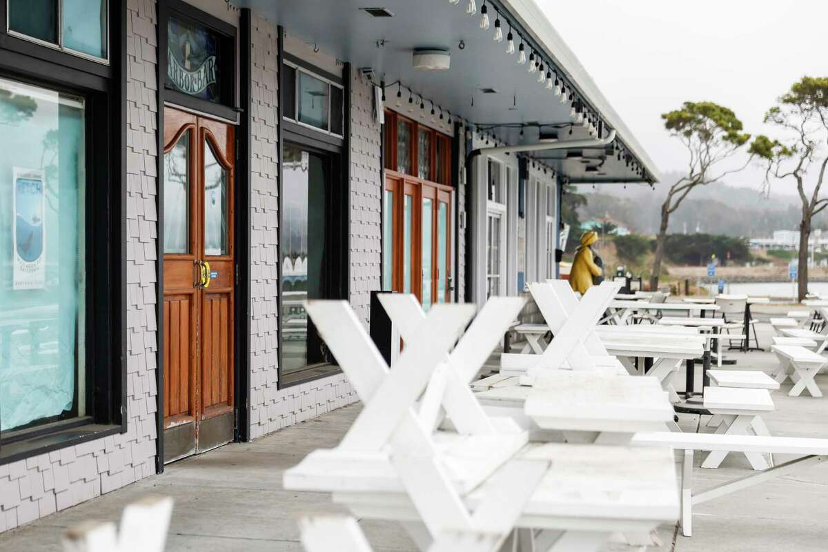 Restaurants at Pillar Point Harbor are seen closed with empty tables at Half Moon Bay, where fishermen typically sell from the docks but don't have much to sell with the salmon fishing season closed this year.