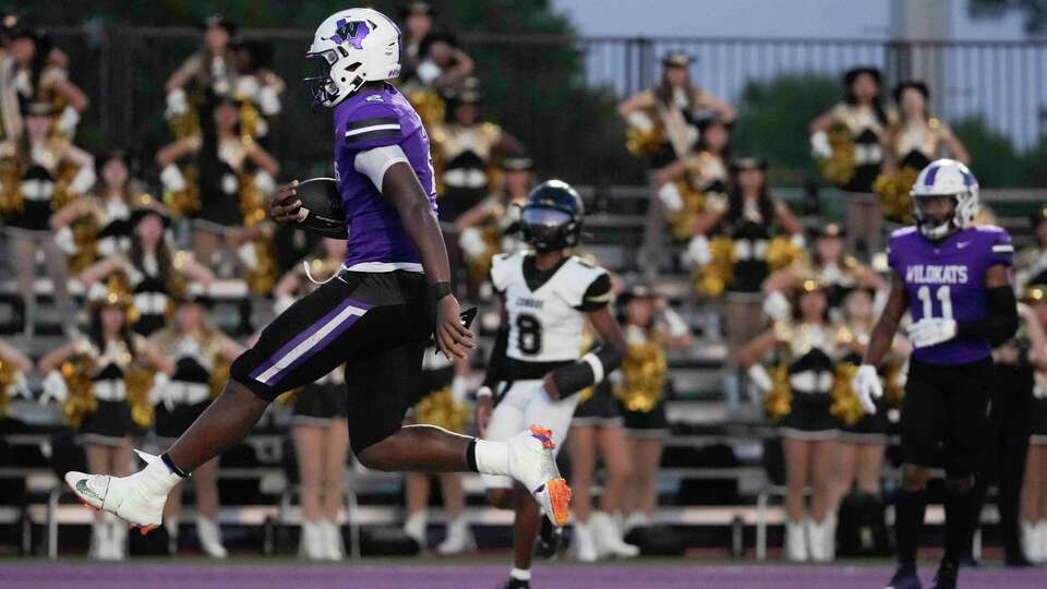 Willis' Derek Lagway (2) leaps into the end zone during the first quarter of a District 13-6A high school football game at Berton A. Yates Stadium, Friday, Sept. 15, 2023, in Willis.