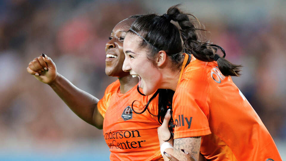 Michelle Alozie #22 of the Houston Dash celebrates her goal with Diana Ordonez #11 during the first half against the Orlando Pride at Shell Energy Stadium on June 03, 2023 in Houston, Texas. (Photo by Carmen Mandato/Getty Images)