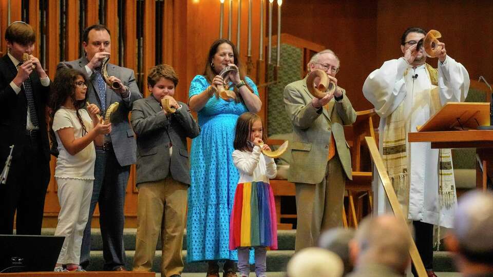 The “Shofar Squad” blow on their shofars ending the Erev Rosh Hashanah service at Congregation Emanu El on Friday, Sept. 15, 2023 in Houston.