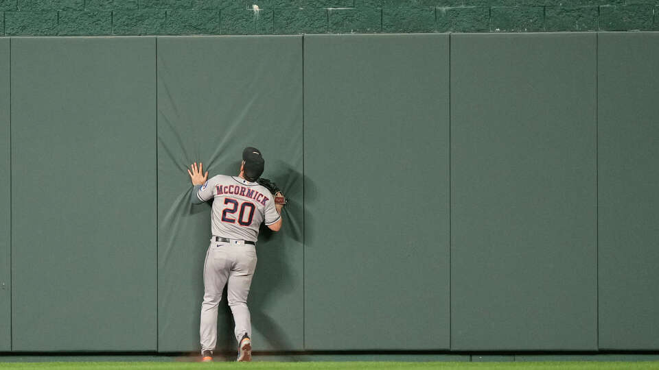 Houston Astros center fielder Chas McCormick chases after a solo home run hit by Kansas City Royals' Nelson Velazquez during the fourth inning of a baseball game against the Houston Astros Friday, Sept. 15, 2023, in Kansas City, Mo. (AP Photo/Charlie Riedel)